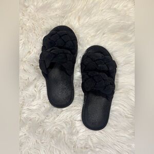 well worn black puffy house slippers shoes